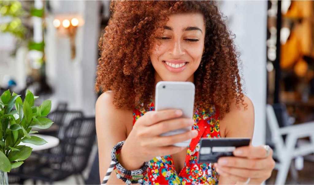 woman making card transaction on mobile phone